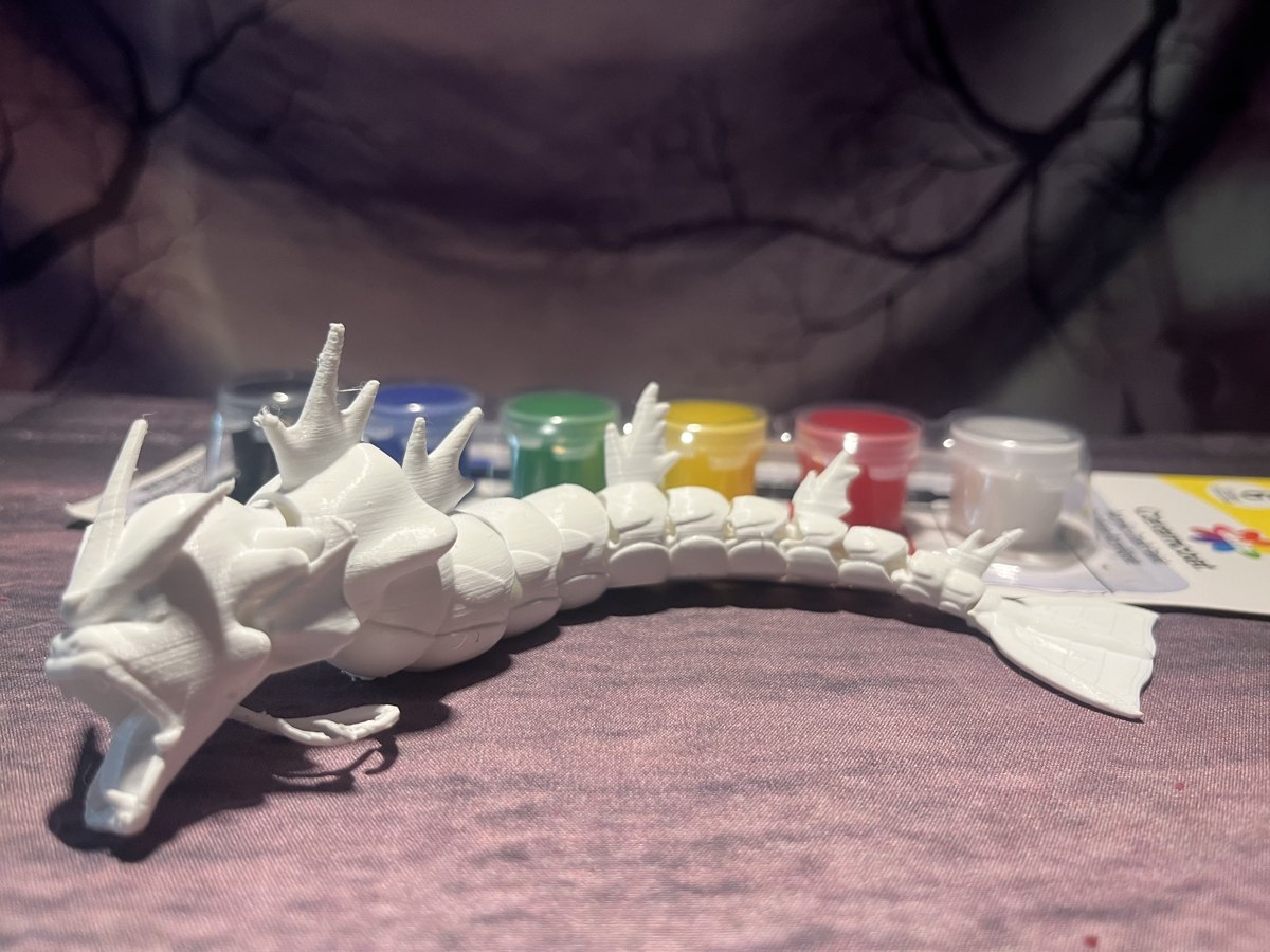 White articulated Gyarados 3D print with acrylic paint set