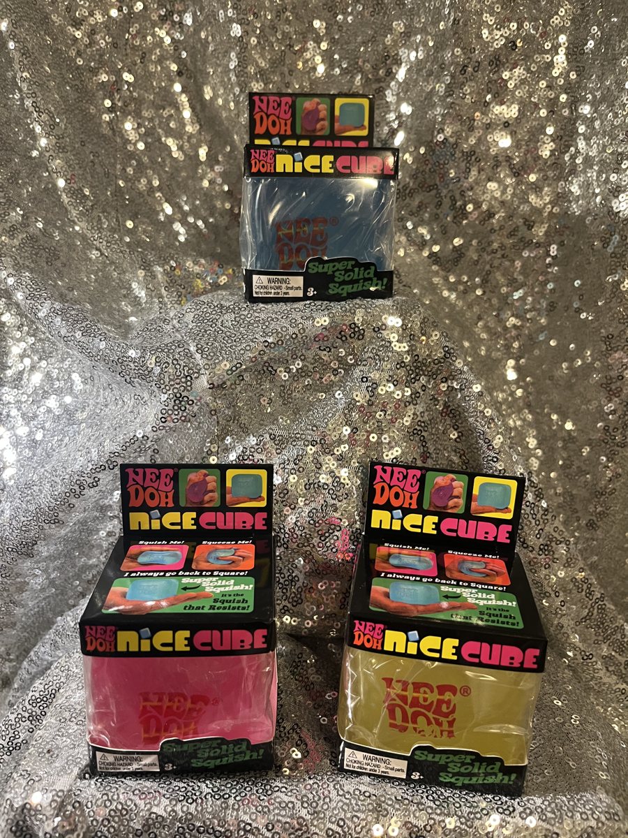 A colorful assortment of Nee Doh Cube squishies